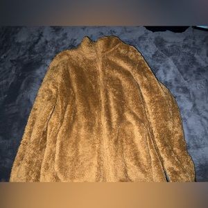 Unisex brown Uniqlo zip up jacket.